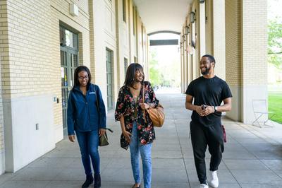 Group of students walking outside on campus