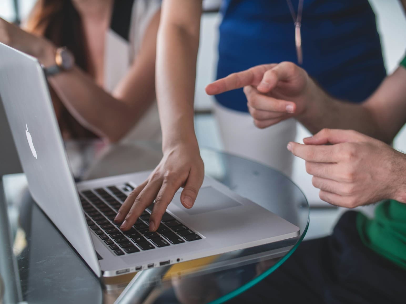 hand pointing to computer