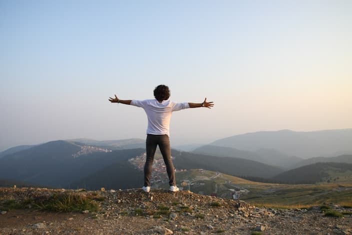 person with their arms stretched out
