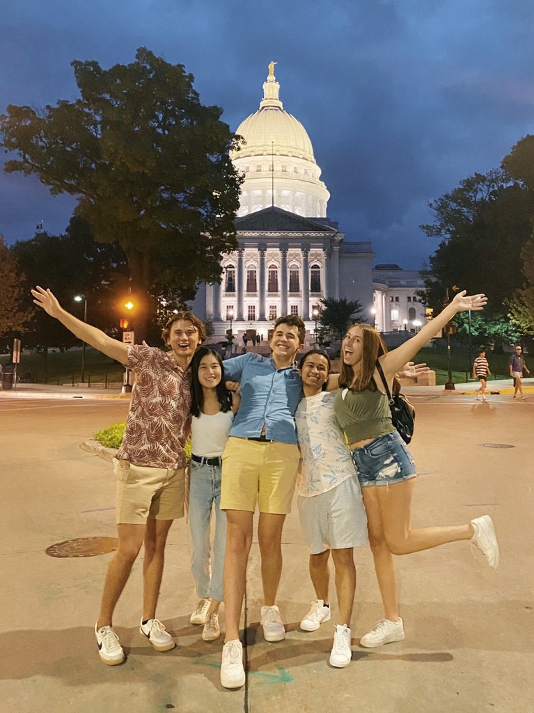 Photo of Calvin and his co-interns in front of the Wisconsin state capitol building