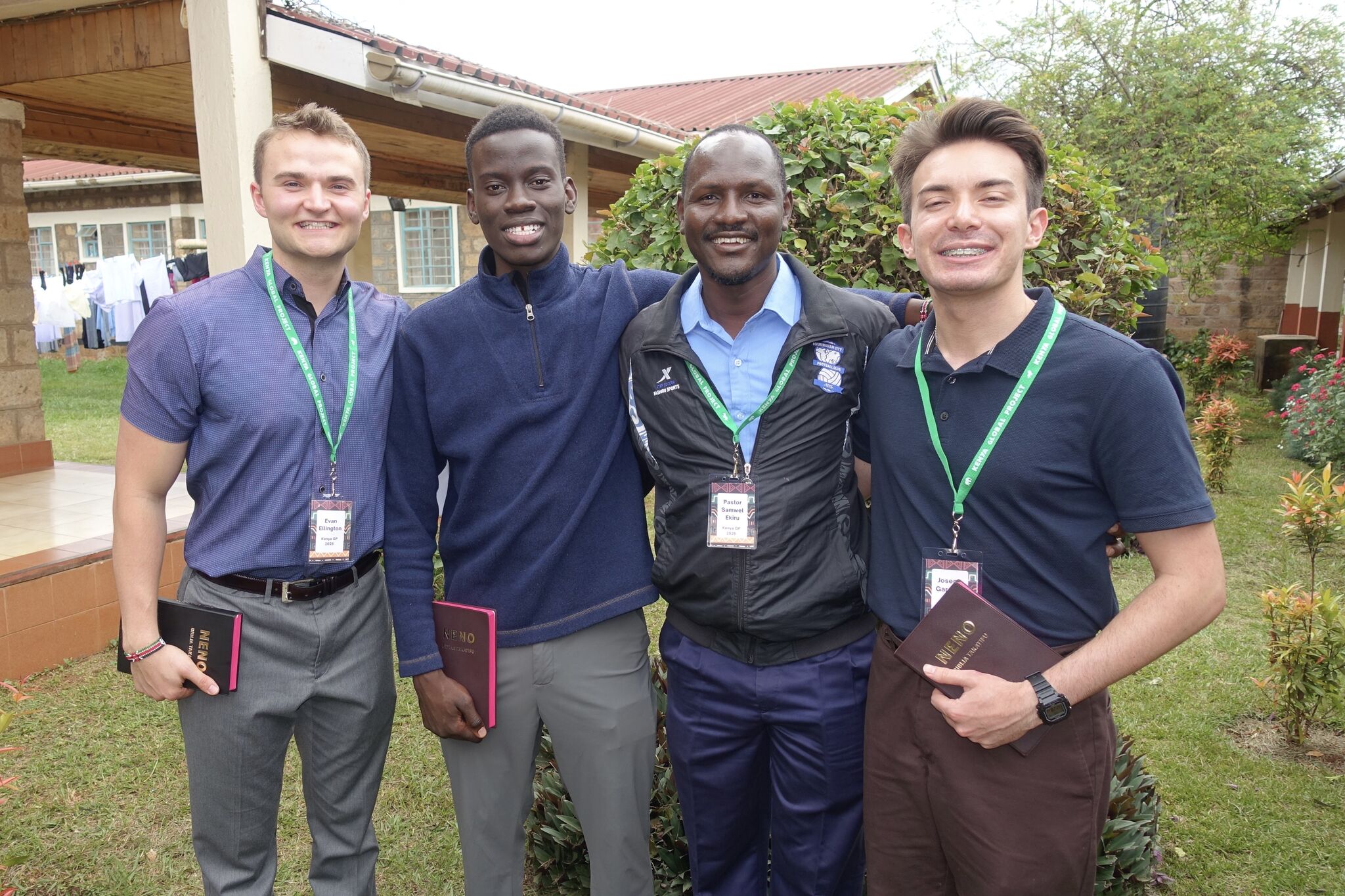 Four local ministry leaders and students outside