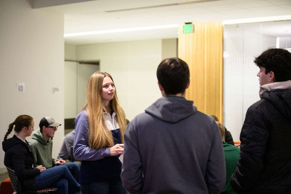 group of students standing and talking