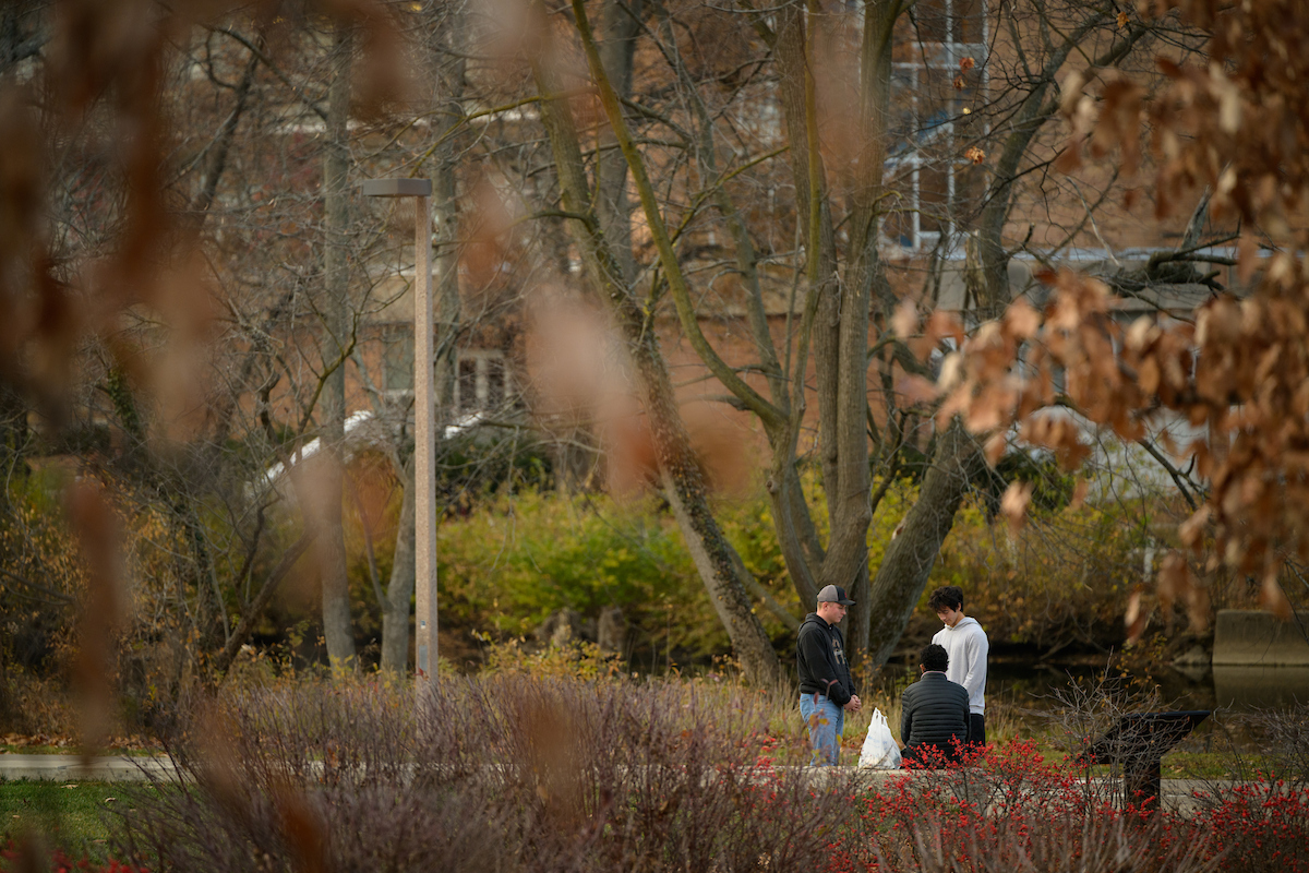 students praying for another student