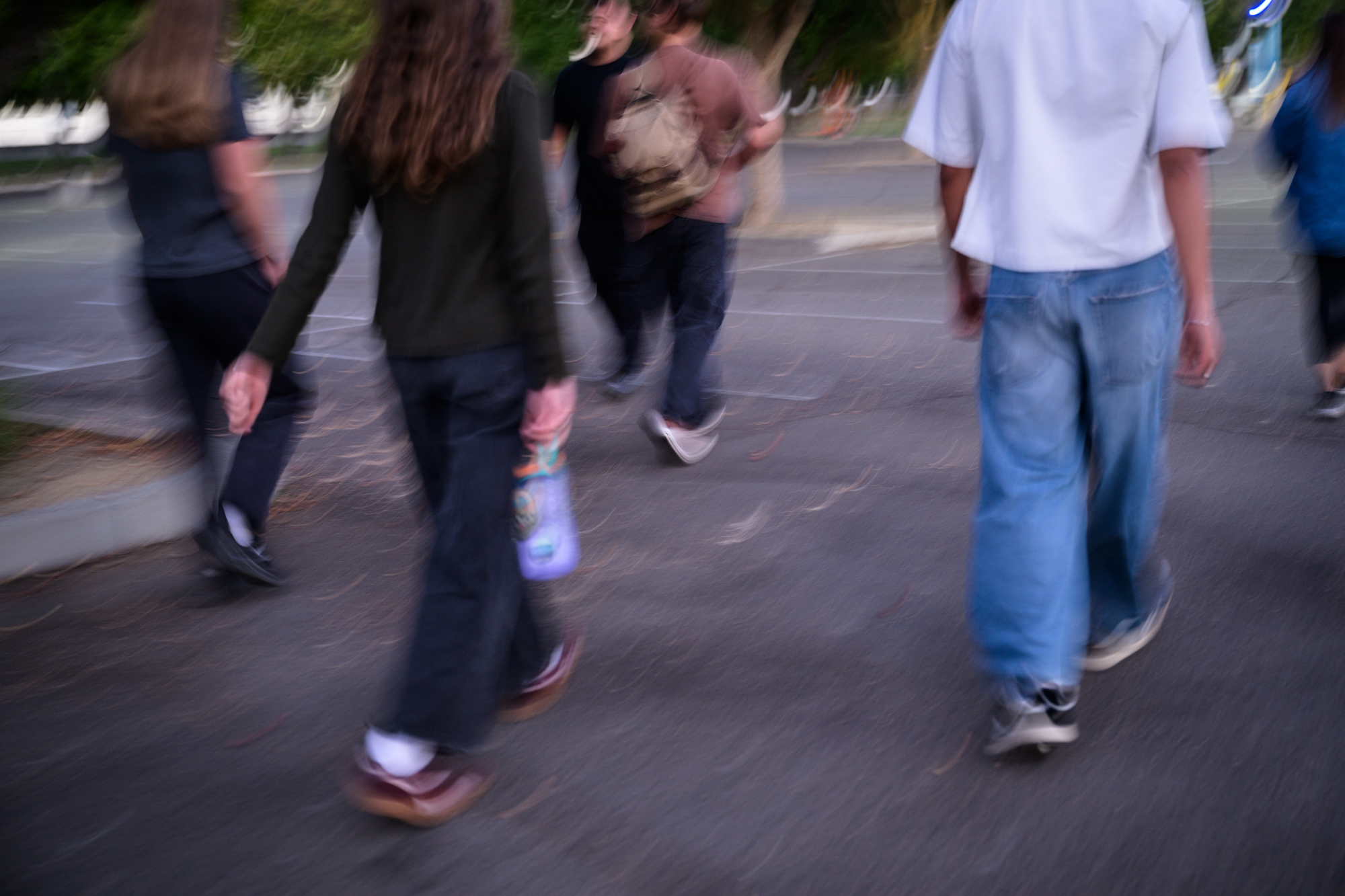 Blurry student feet are seen walking to their next prayer location.