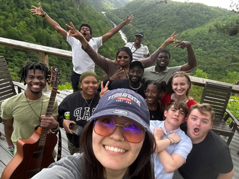 A group of students from an international student ministry chapter gather for a group photo