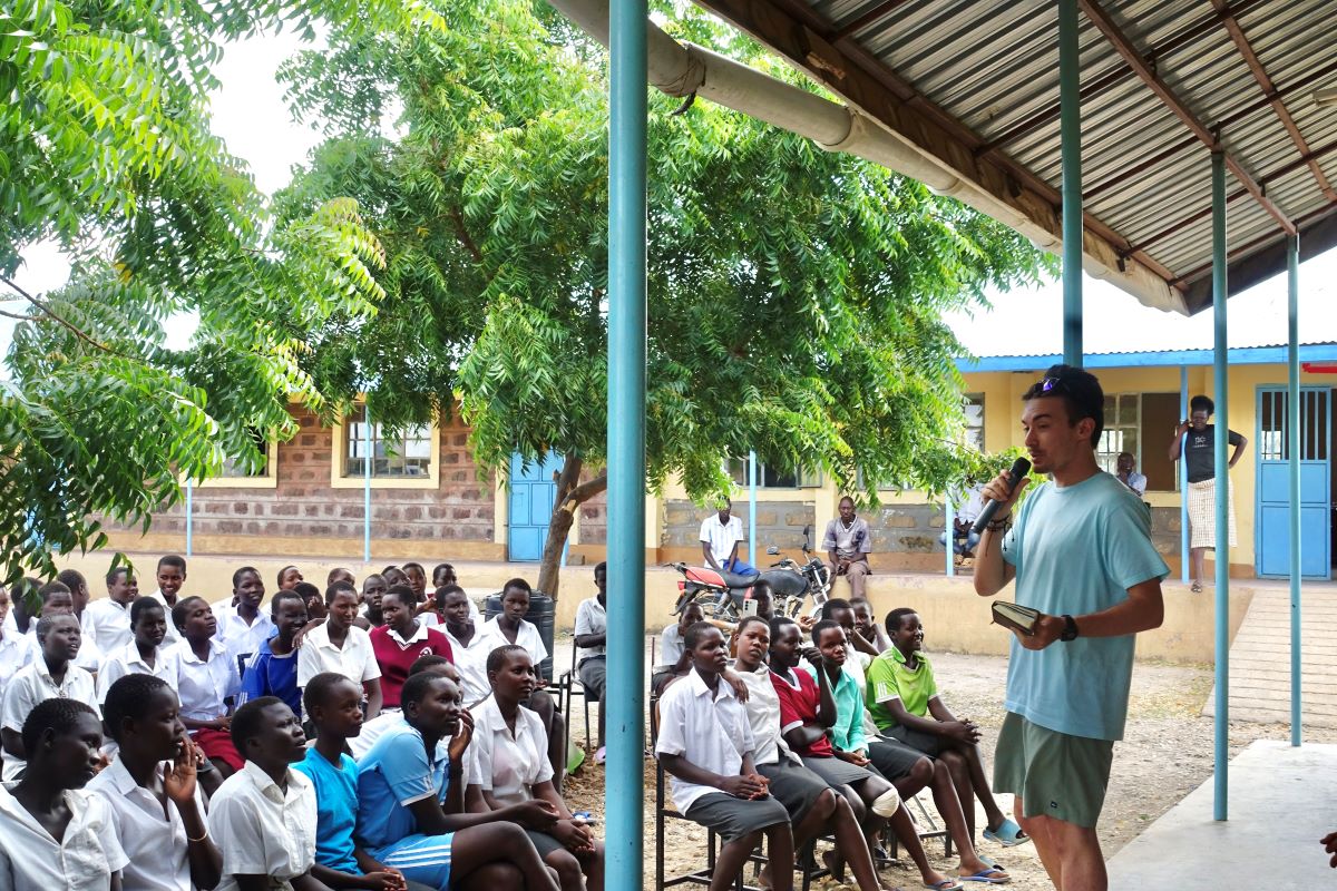 Joseph (college student) preaching at a local all-girls school in Kenya