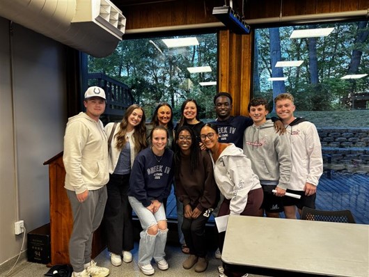 Students from Greek InterVarsity gathering for a group photo