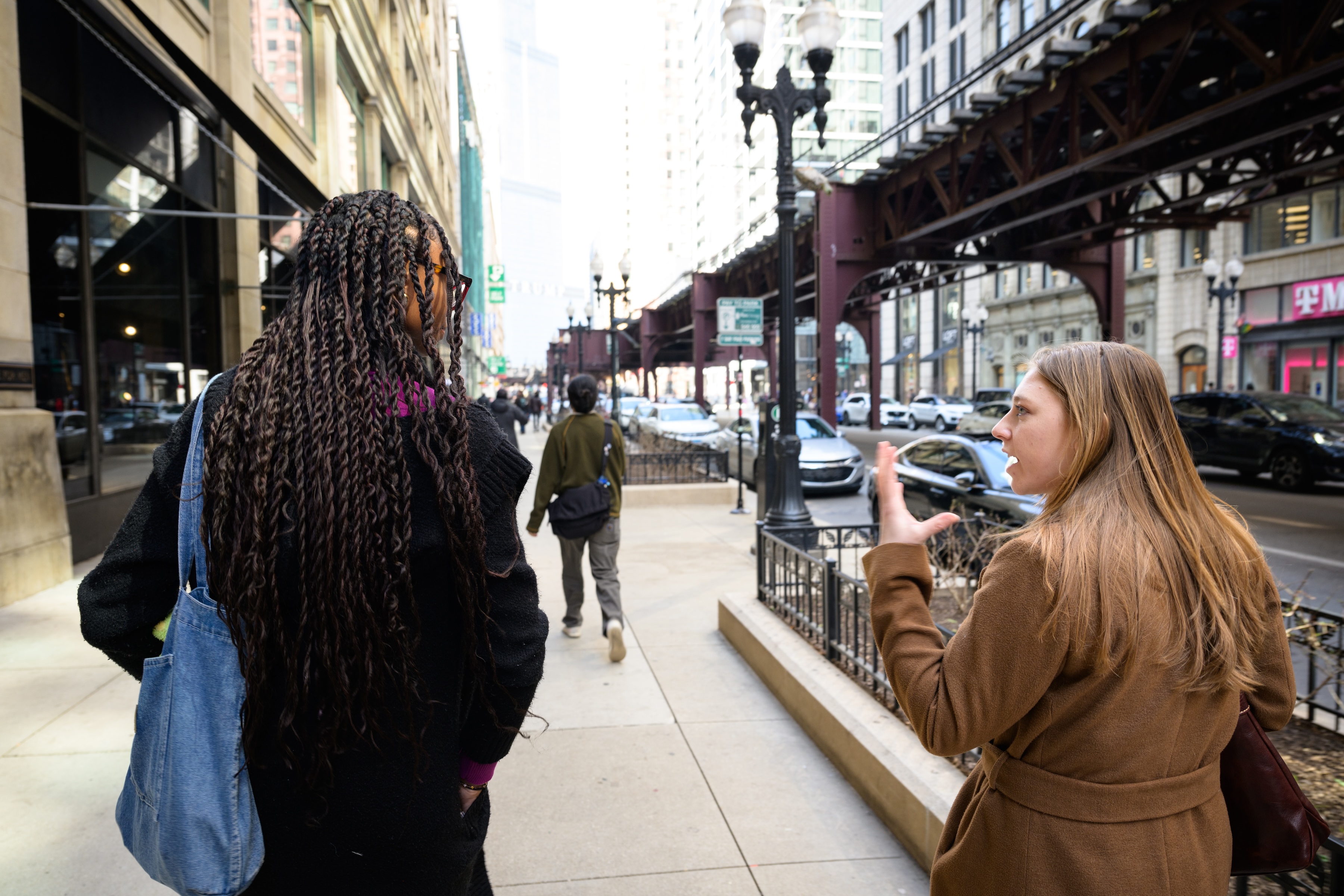 Teila walks down the street in Chicago