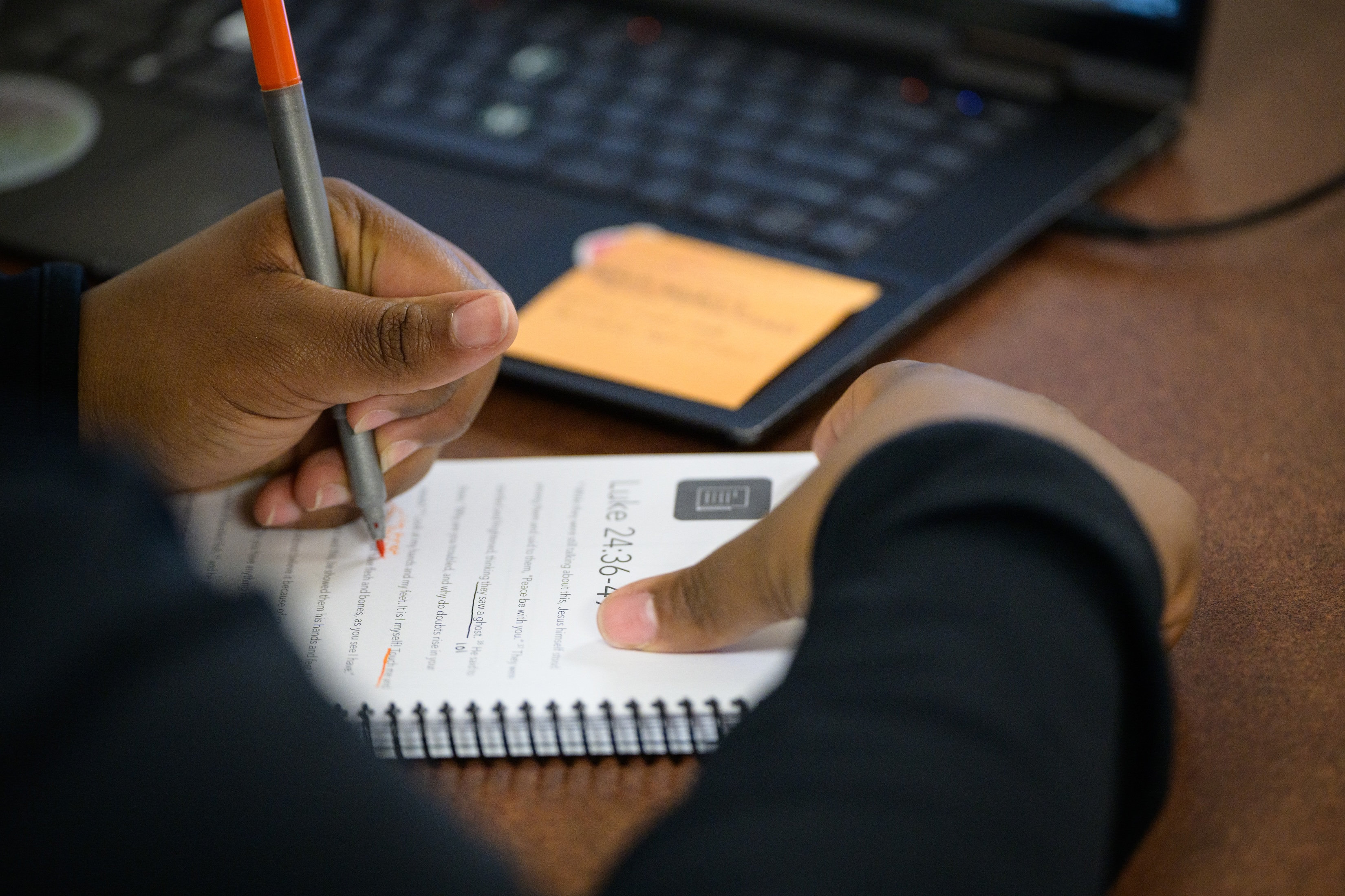close up of a student doing a manuscript Bible study