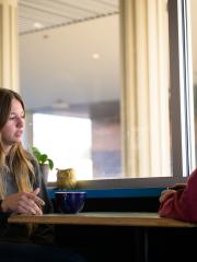 Student meets with staff for coffee meeting. 
