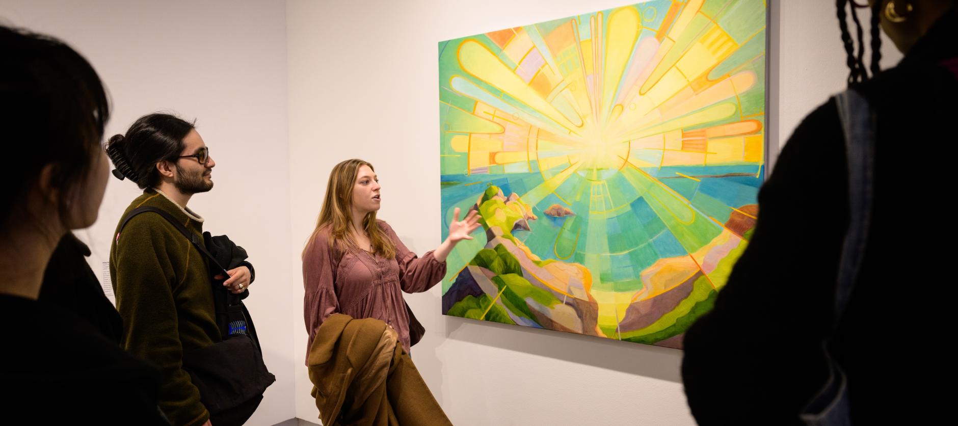 Teila shows some of her fellow InterVarsity friends her art