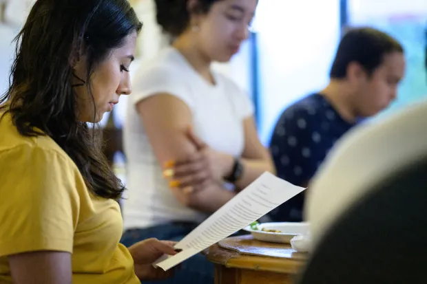 students looking at bible passages