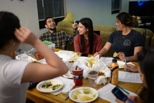 Bible study and food around a dining room table