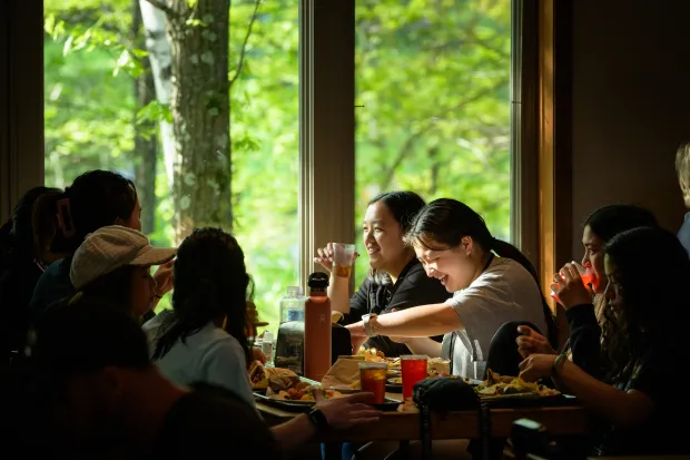 group of students eating and laughing