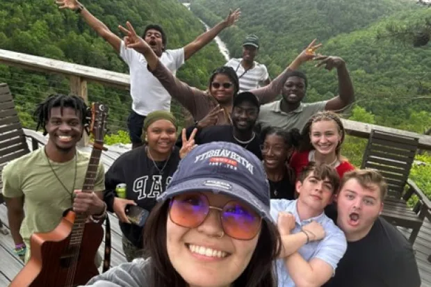 students smiling for photo outside