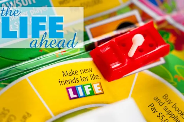 Life board game on the Make New Friends for Life square with the words "The Life Ahead" in the background.