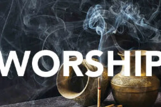 One urn turned on its side and one urn upright with stick of incense and the word "Worship" across the image