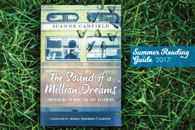 Book Cover of The Sound of a Million Dreams by Suanne Camfield on grass background with Summer Reading Guide 2017