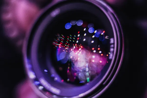 A hand holding a camera up as if to take a picture of something