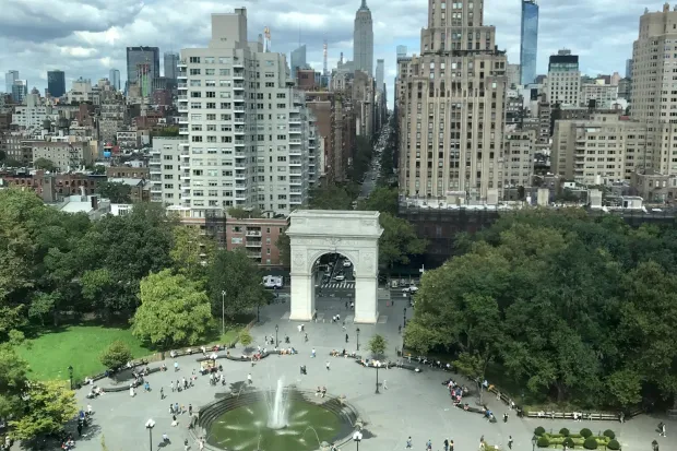 an aerial picture of the New York City skyline and NYU's campus