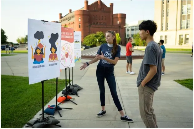 two students on campus looking at a proxe 