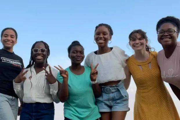 Group photo of students from BCM chapter outside on beach