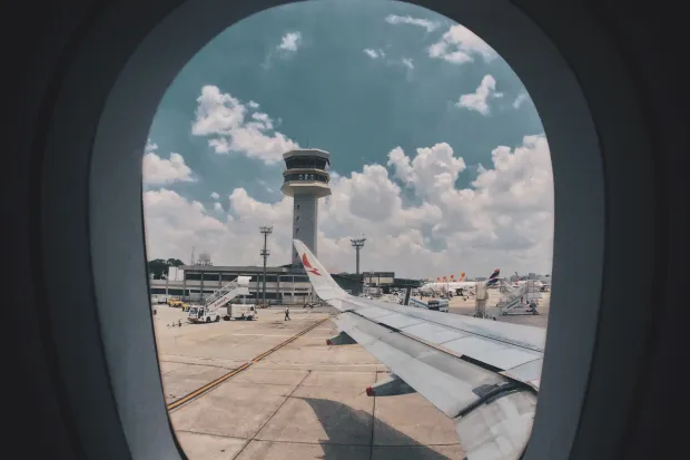 the wing of an airplane seen from inside the plane