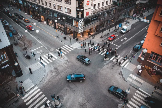 A busy four-way intersection in an urban downtown