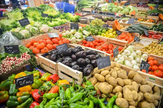 Produce section of grocery store with broad, colorful range of fruits and vegetables