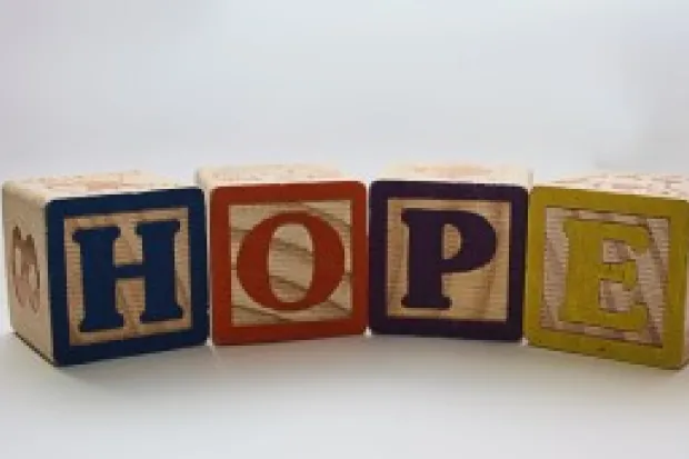 Multicolored building blocks spelling out the word "hope"