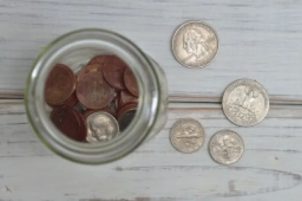 Glass jar full of pocket change