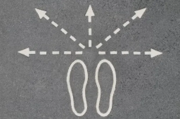 Chalk outline of footsteps with five arrows pointing outward in all directions