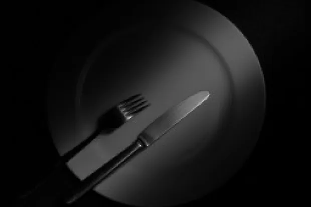 a black and white photo of an empty plate