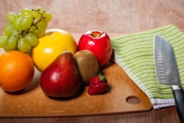 Fruit resting on a wooden table representing the fruit of the Spirit.