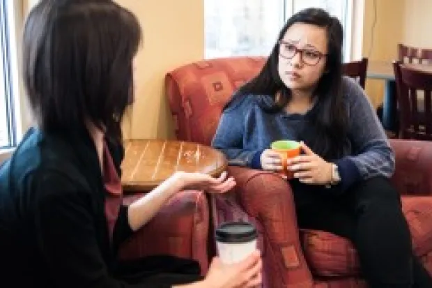 two women having a serious conversation