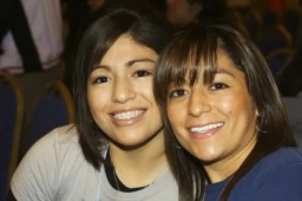 two Latina women smiling together