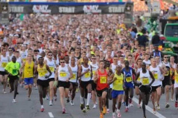 Large crowd of people running marathon