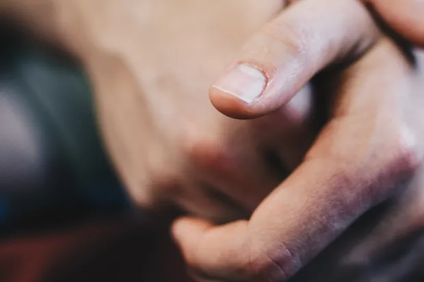 Closeup of hands overlapping each other