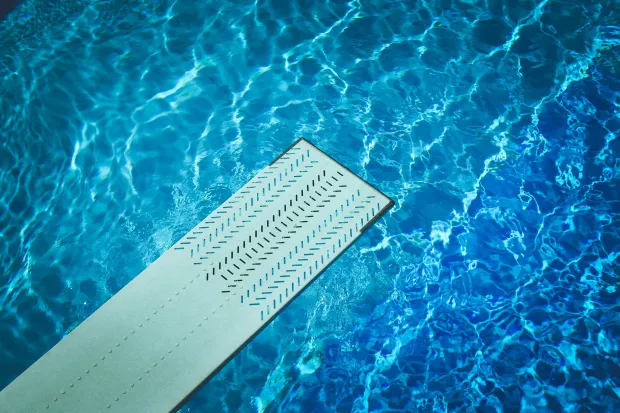 Diving board overlooking pool