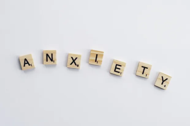 The word "Anxiety" spelled out with Scrabble letters