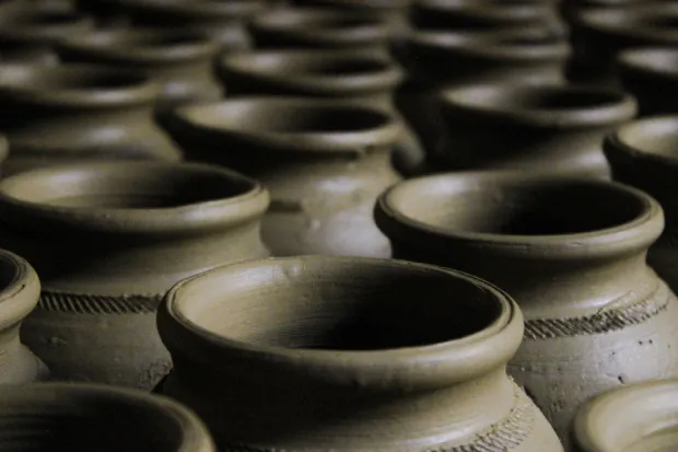 Closeup of a group of grey clay jars