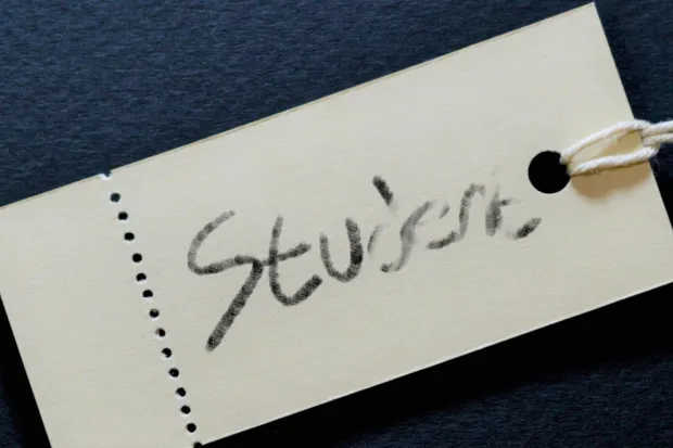 Label with the word "Student" partially erased