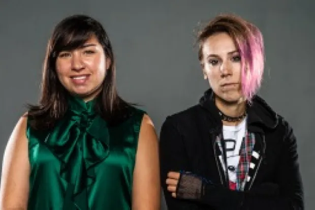 two women side by side, one in mainstream clothes and the other in punk/alternative clothing