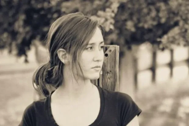 Black and white portrait of young woman looking off to the side