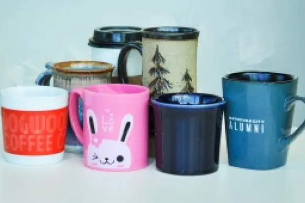 a collection of random mugs