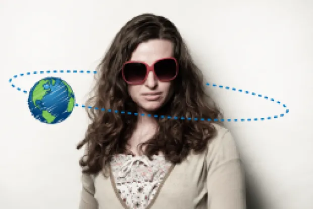 a woman with sunglasses and a small picture of Earth revolving around her head