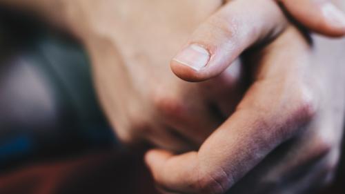 Closeup of hands overlapping each other