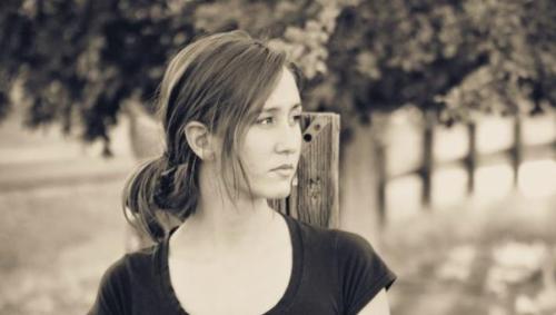 Black and white portrait of young woman looking off to the side