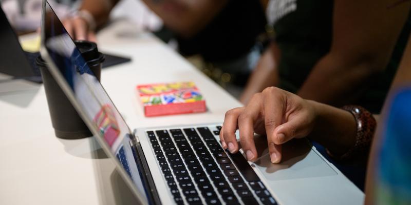 hand on a laptop keypad