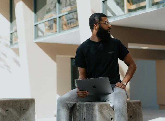 black student sitting with laptop